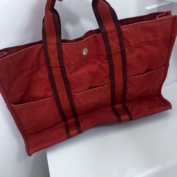 Handbags - Hermes red canvas 👜 tote.